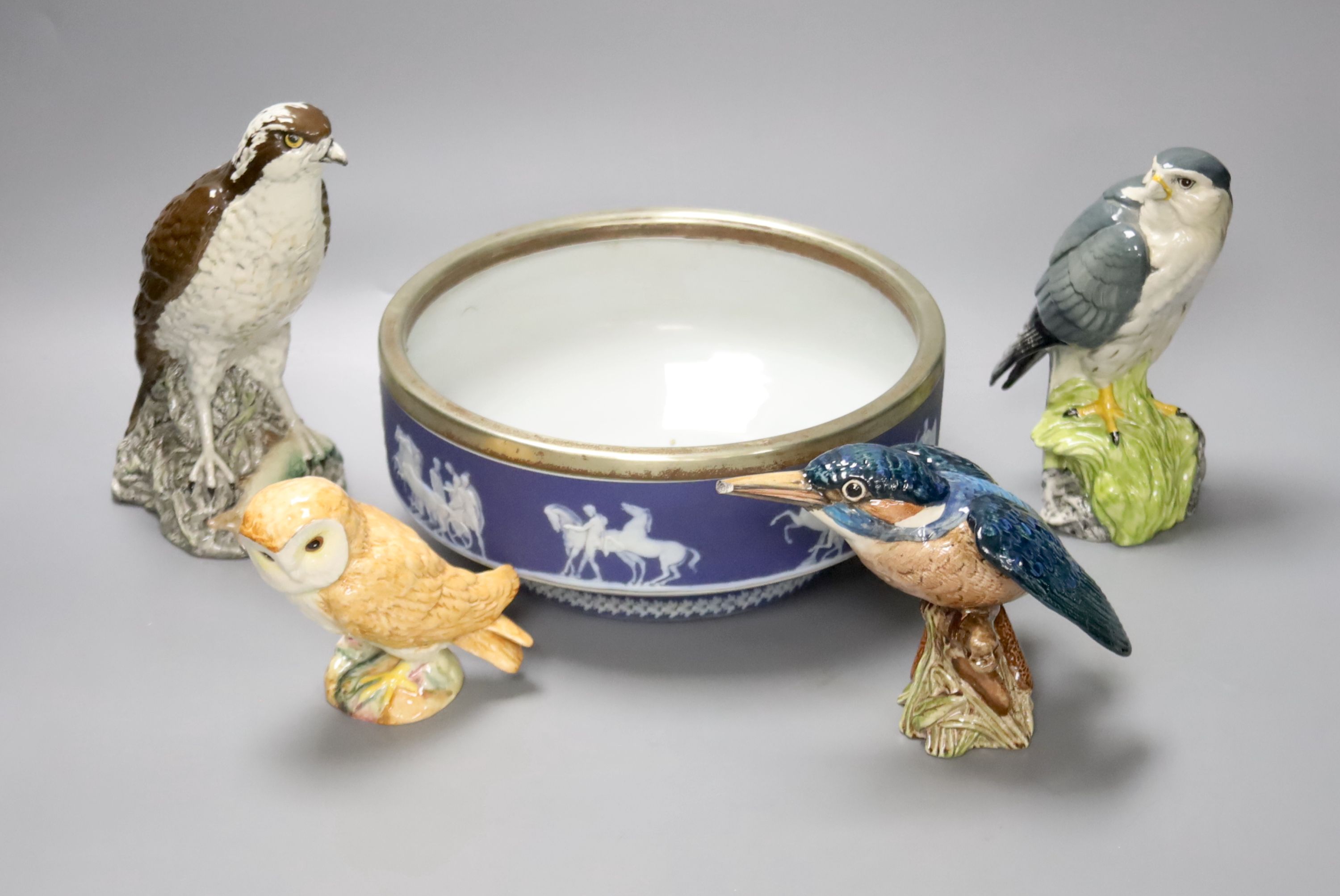 Three Beswick bird figures, a Royal Doulton Whyte & Mackay Scotch Whisky 'Merlin' figure, together with a large Wedgwood jasperware type bowl with silver plated collar